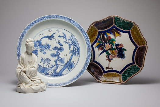 A seated blanc-de-Chine figure of Guanyin, Blue and white dish & a Kutani dish